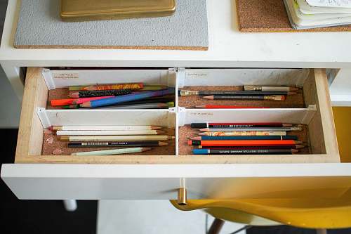 new york colored pencils in white wooden drawer united states